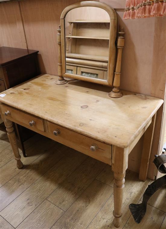 A Victorian pine two drawer dressing table W.106cm